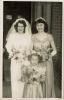 Joyce at her wedding with her bridesmaid and flower girl